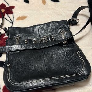 B Makowsky pebbled leather black purse with silver buckles and animal print